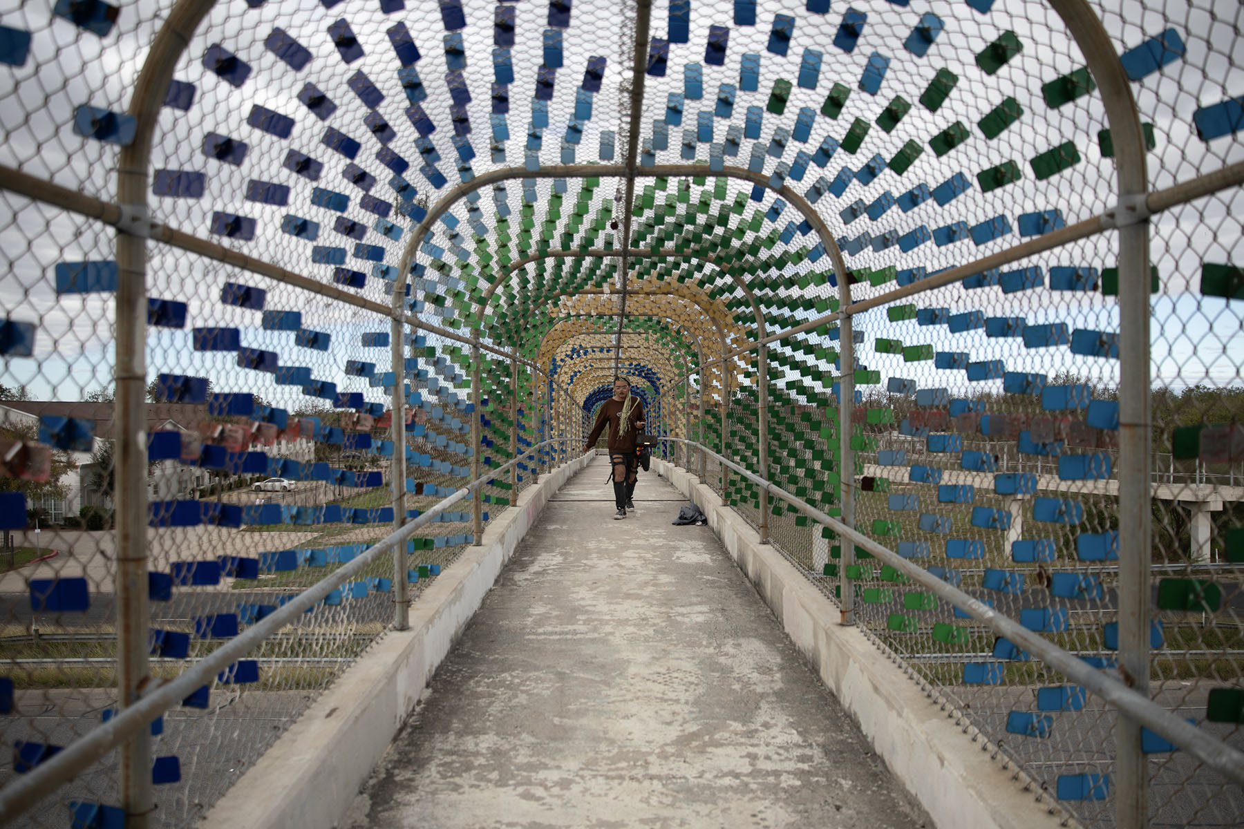 Morningstar walks on a bridge as she makes her way to Palo Alto College.