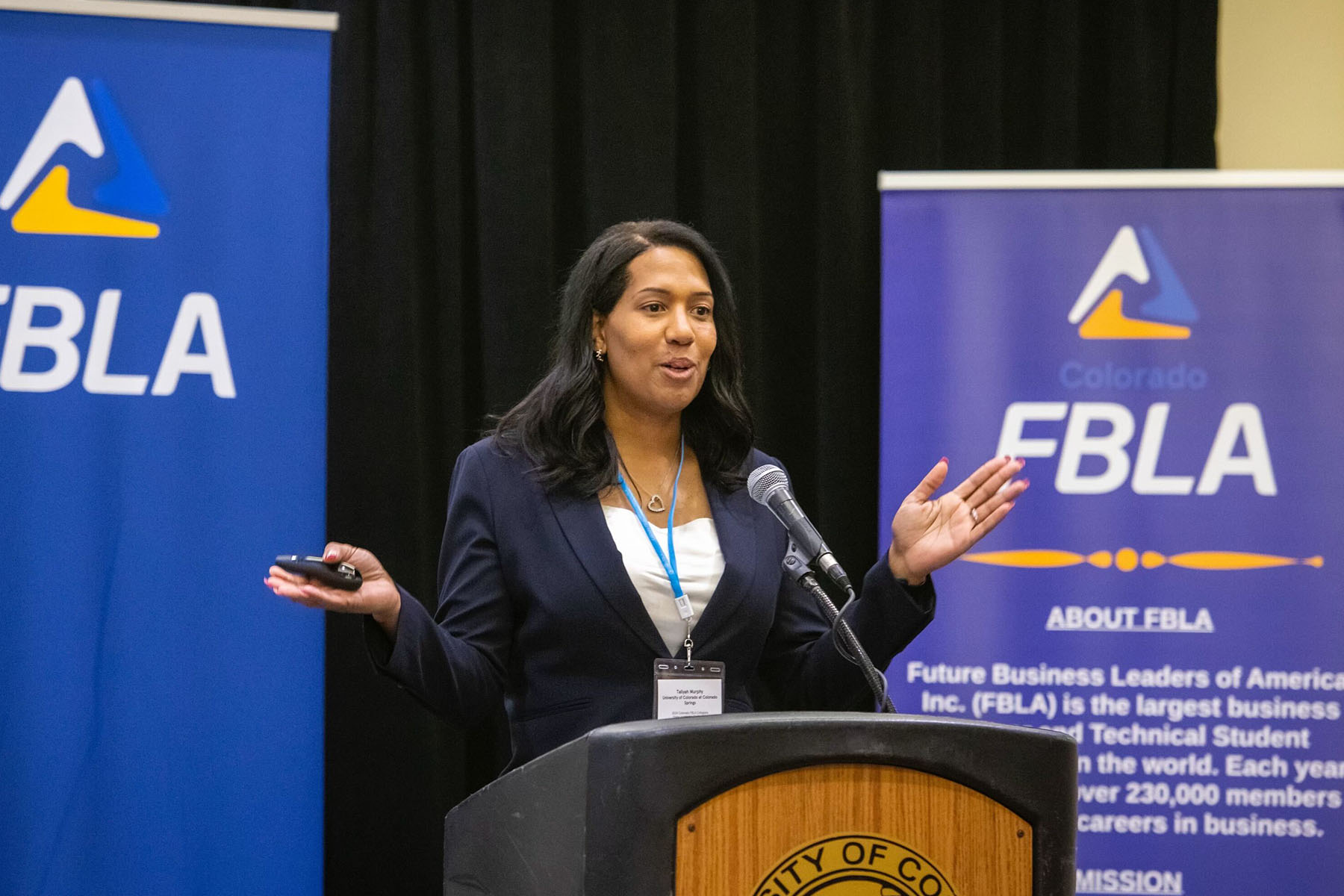 Taliyah Murphy is seen speaking at a podium at a conference she participated in.