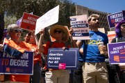 Members of Arizona for Abortion Access protest against the 1864 abortion ban at the Arizona House of Representatives.