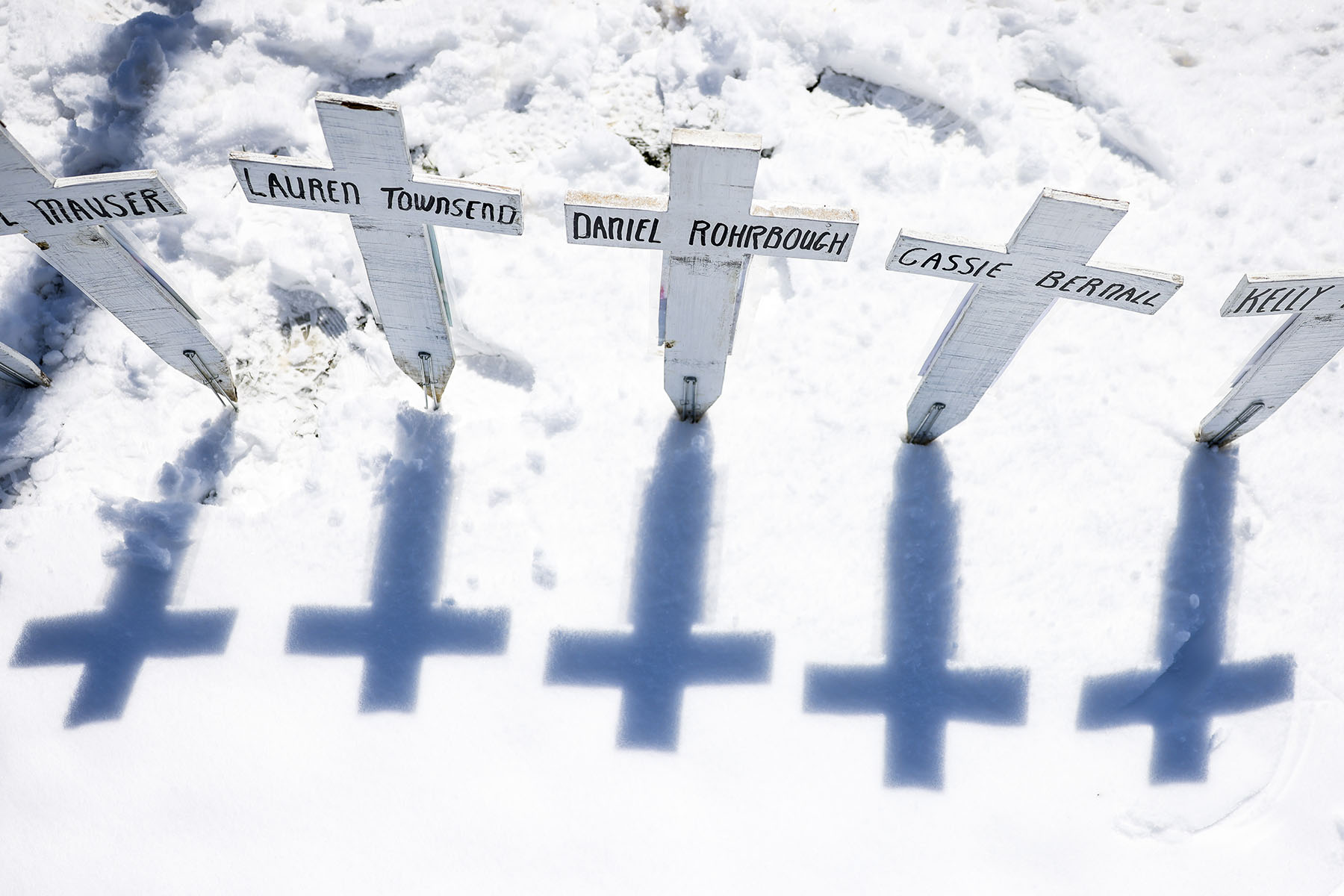 Crosses with the names of the victims of the Columbine High School shooting sit next to the Columbine Memorial.