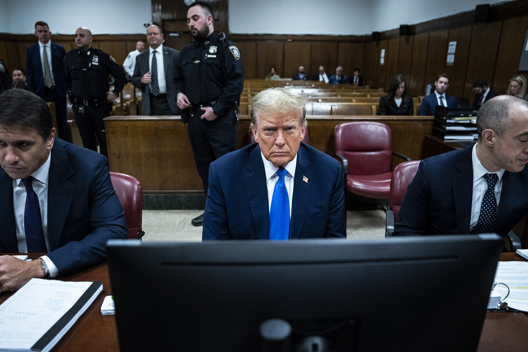 Former President Donald Trump arrives for his criminal trial with his legal team at Manhattan Criminal Court