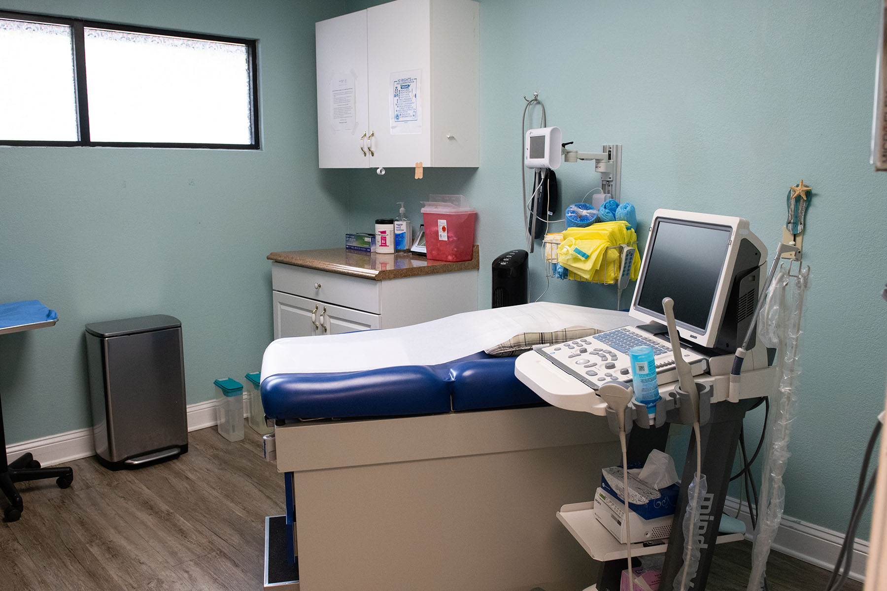 An empty examination room is seen at A Woman's Choice