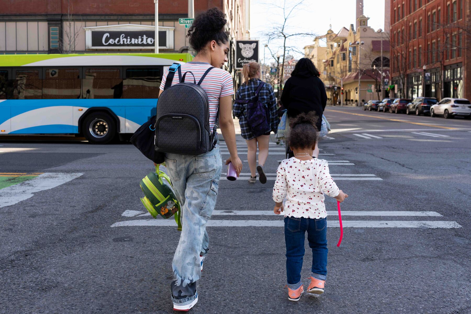 Kaleeya Baldwin and her daughter, Akylah, walk home after school.