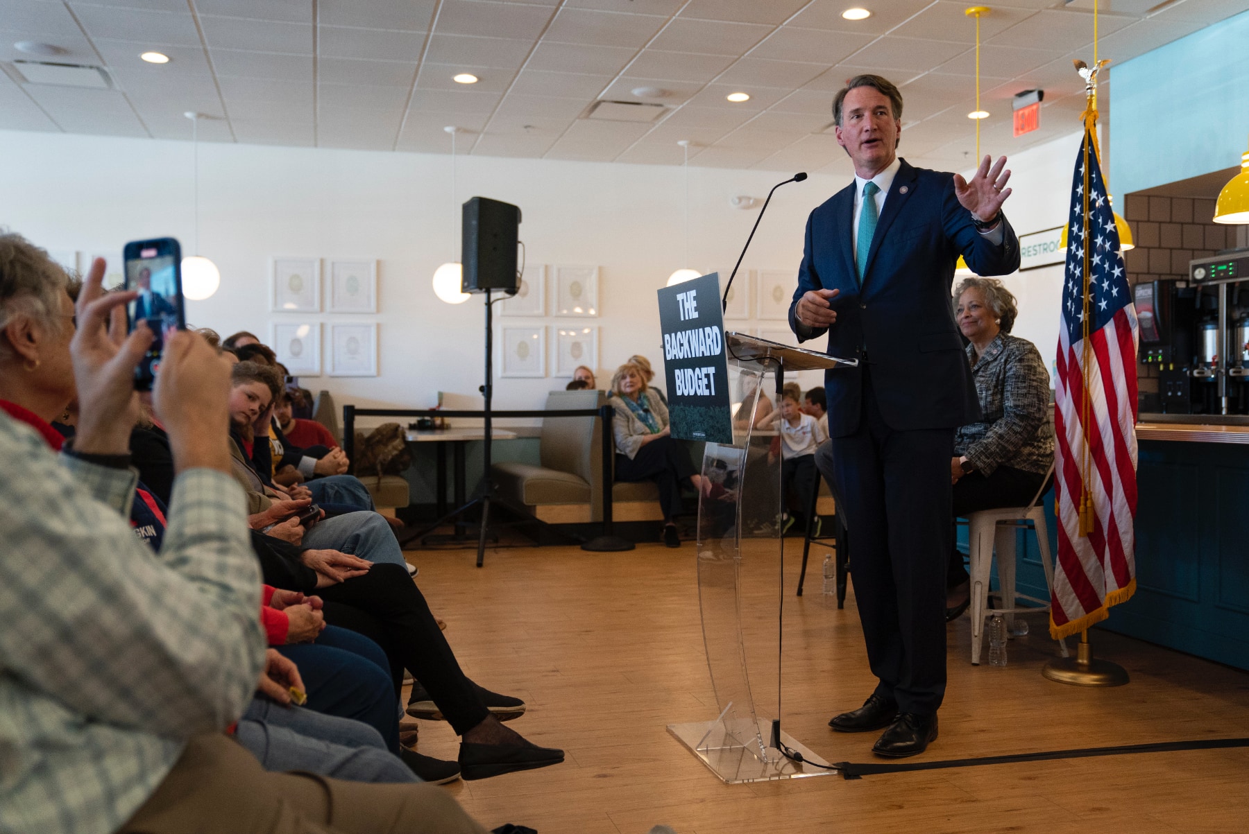 Virginia Gov. Glenn Youngkin speaks in front of a group of people in Richmond