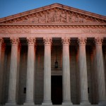 The U.S. Supreme Court is seen at dawn.