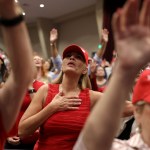 Supporters pray during an 'Evangelicals for Trump' campaign event.