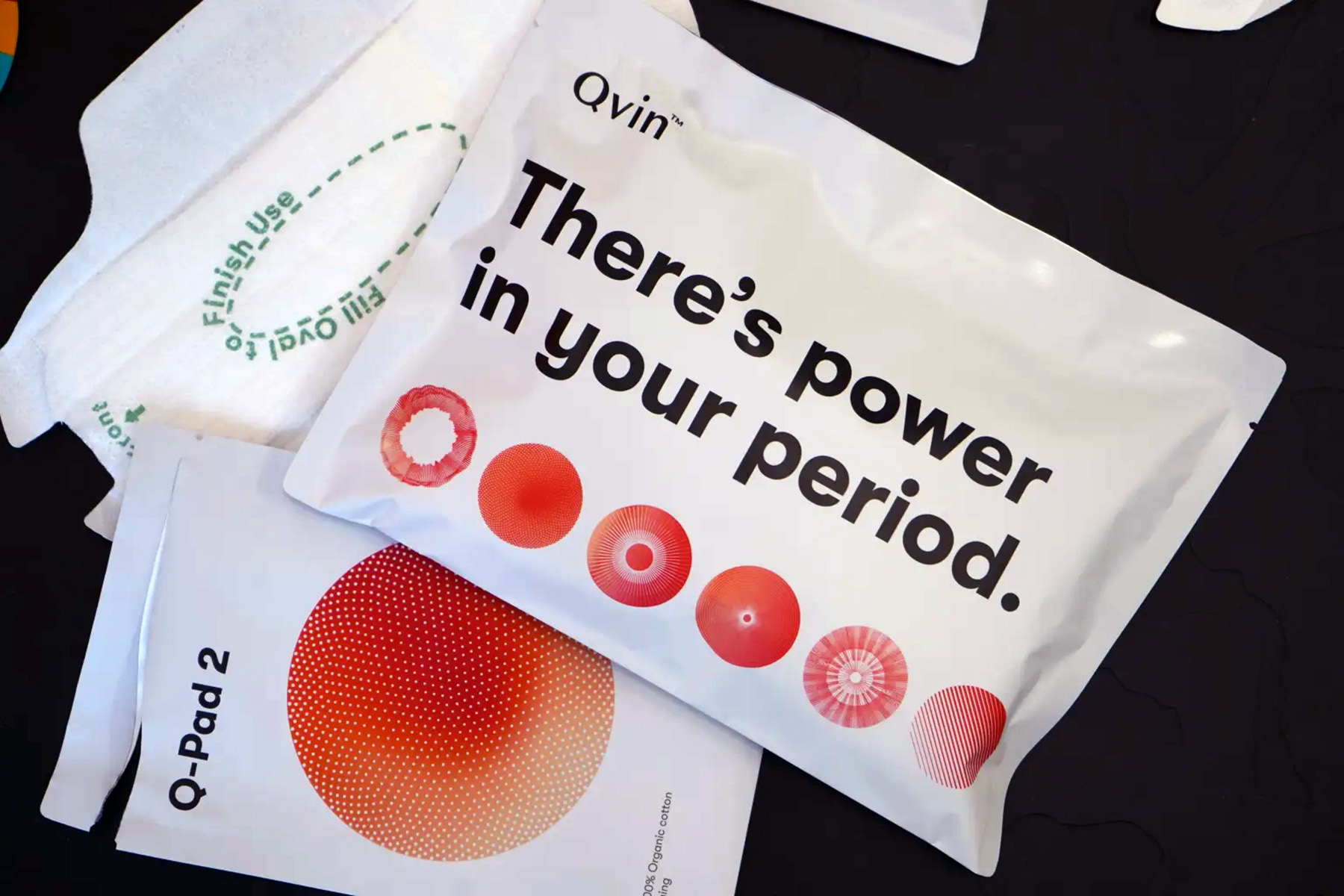 The packaging of Qvin's Q-pads reads "There's power in your period."