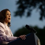 Kamala Harris is seen giving a speech at a podium.