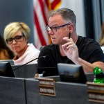 School Board President Joseph Komrosky makes a point during a school board meeting.