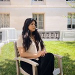 Yolenna Regmi poses for a portrait in a courtyard on Capitol Hill.