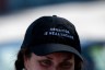 A volunteer wears a hat that reads 