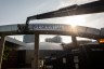 People on a crane place a banner that reads 