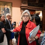 Republican state Sen. Katrina Shealy receives applause from supporters as she walks through the South Carolina Capitol.