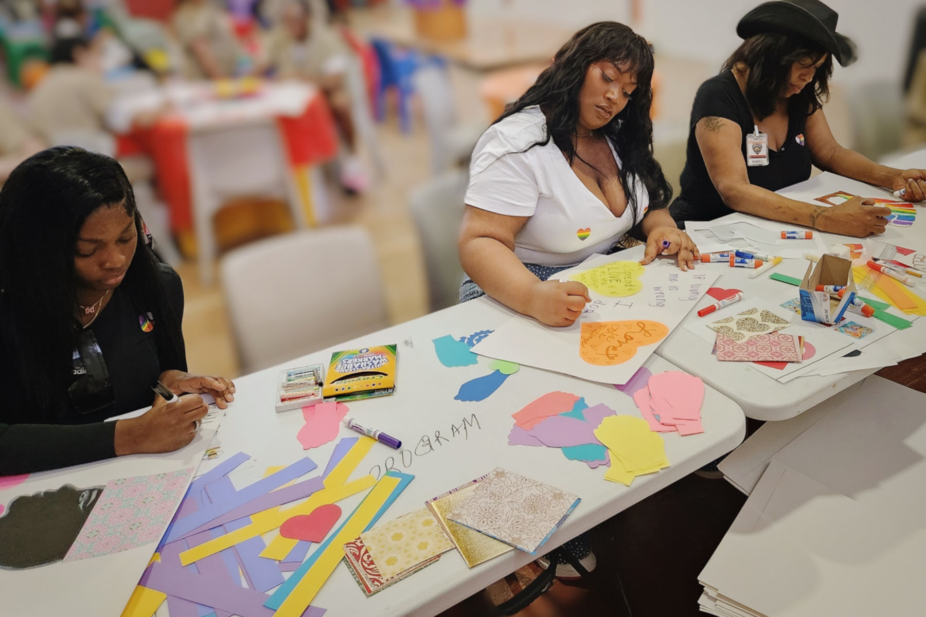 Mother Lil Kim Juicy, Jordyn Jay, and Eve Harlowe make pride posters at Rikers.