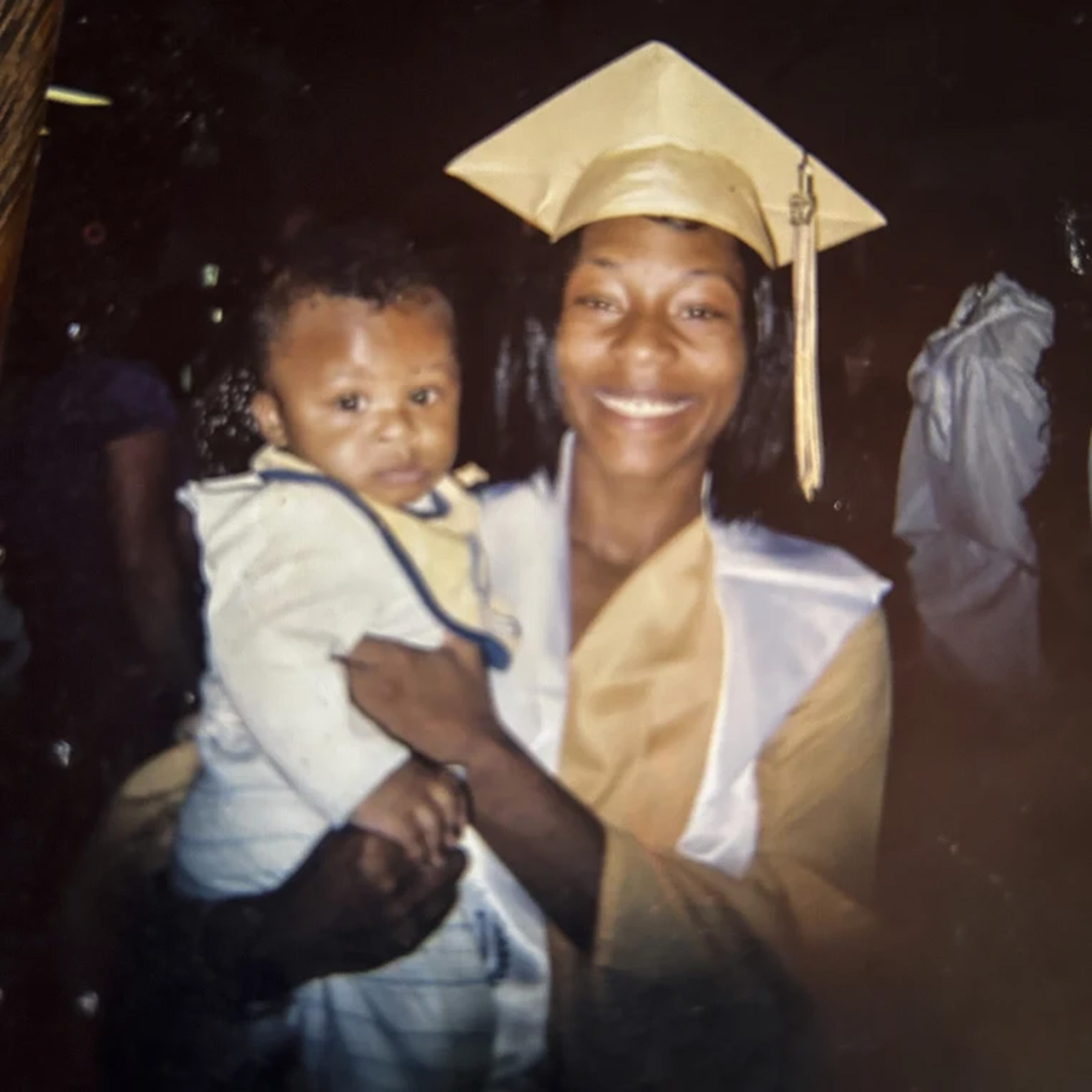 Sonya Massey holds an unidentified boy.