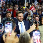 Sen. JD Vance and his wife Usha Chilukuri Vance are greeted by delegates as they arrive at the Republican National Convention.