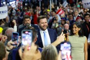 Sen. JD Vance and his wife Usha Chilukuri Vance are greeted by delegates as they arrive at the Republican National Convention.