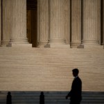 A man walks past the U.S. Supreme Court in Washington, D.C.