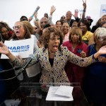 Rep. Maxine Waters is surrounded by supporters of Kamala Harris at a Los Angeles event.