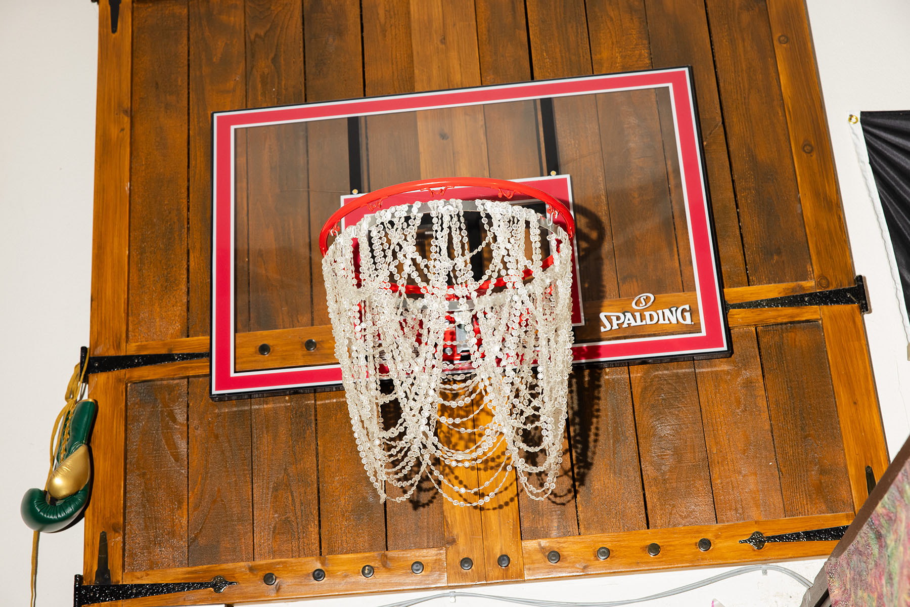 A basketball net chandelier hangs at the Sports Bra.