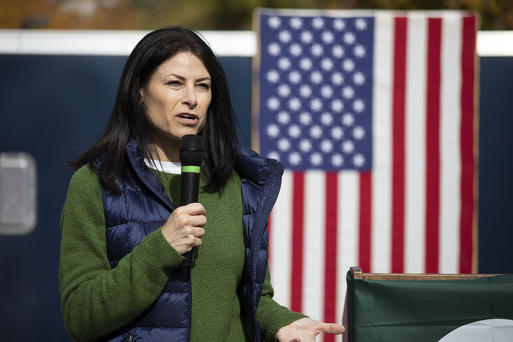 Michigan Attorney General Dana Nessel speaks in front of an American flag.