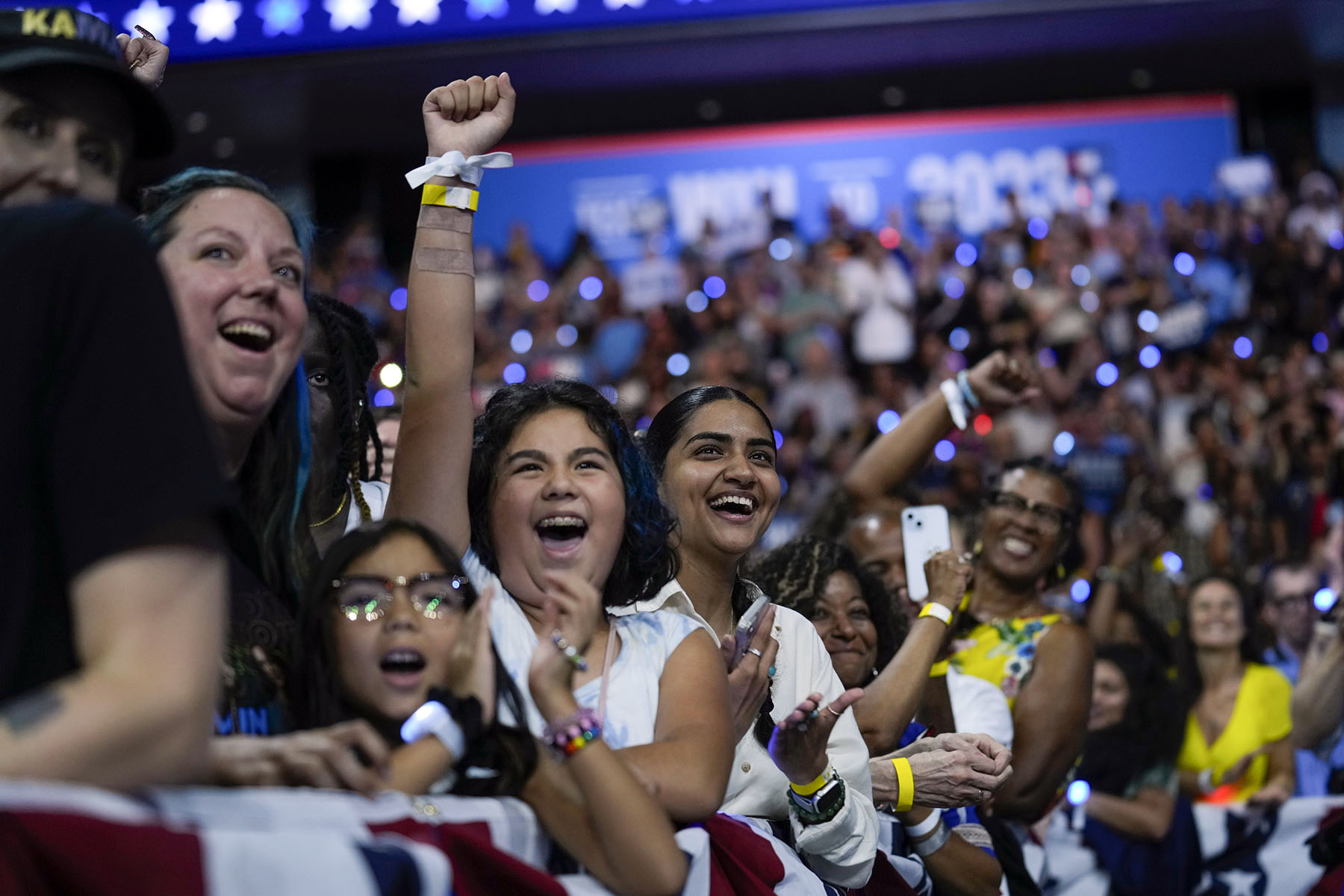 Supporters cheer as VP Kamala Harris and her running mate Minnesota Gov. Tim Walz speak at a campaign rally in Philadelphia. Pennsylvania.