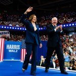 Vice President Kamala Harris and her running mate, Minnesota Gov. Tim Walz, greet supporters during a campaign event in Philadelphia.