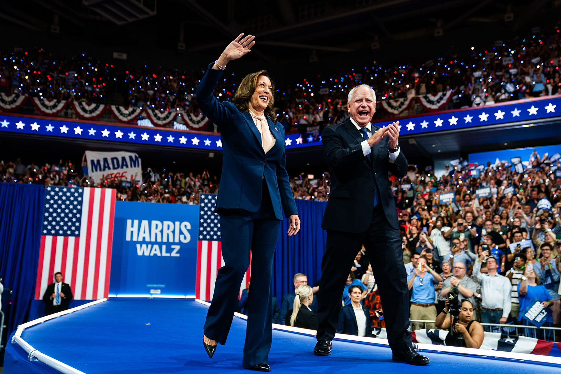 Vice President Kamala Harris and her running mate, Minnesota Gov. Tim Walz, greet supporters during a campaign event in Philadelphia.