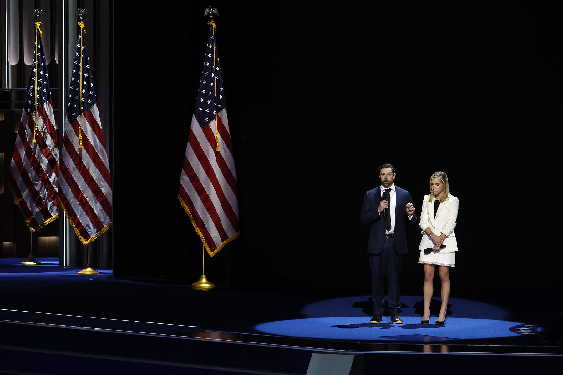 Josh Zurawski and Amanda Zurawski speak onstage during the first night of the DNC.