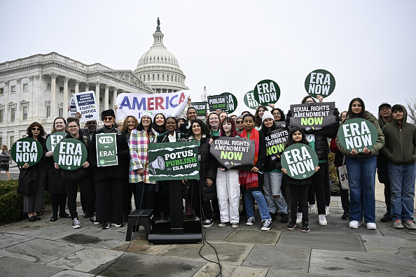 Crowd gathered outside the capitol with signs about passing the equal rights amendment now.