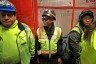 Women in construction ride a service elevator in Boston.