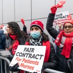 Nurses in red hats and scarves hold signs reading “Fair contract for patients & nurses” during a strike outside Montefiore Medical Center in New York.