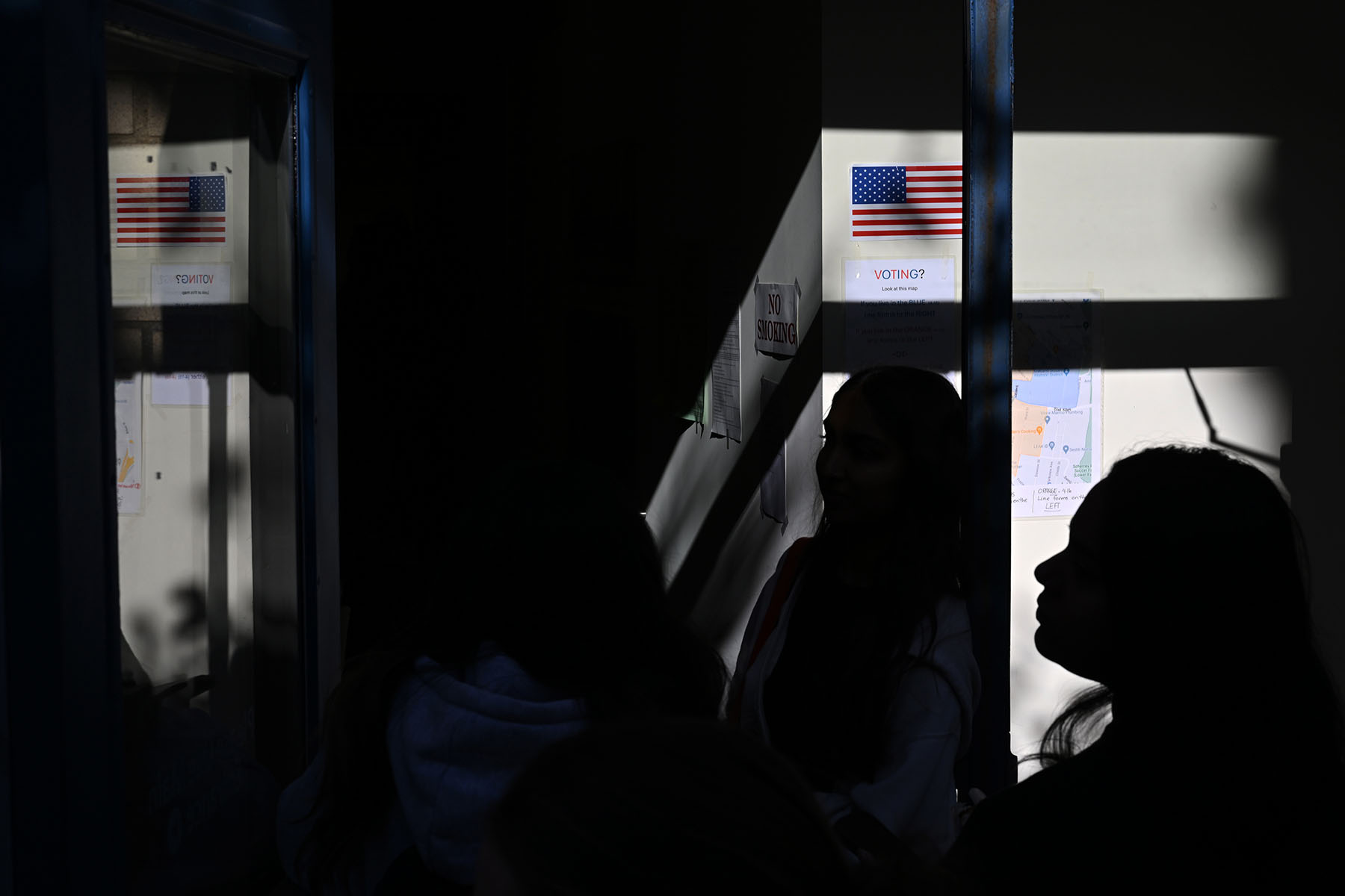 People wait in line to vote at the Oakland Career Center on November 5, 2024.