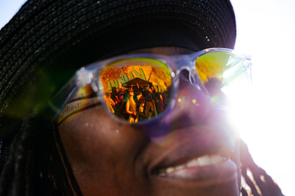 The dance floor is reflected in Terri Flamer’s sunglasses.