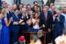 President Donald Trump, joined by Republican lawmakers, holds a gavel after signing the 